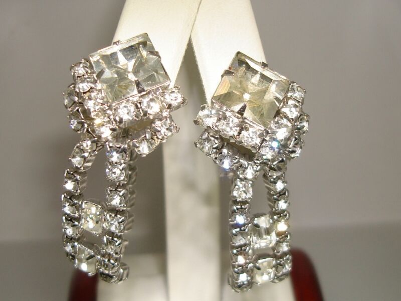 Vintage 1960s-70s rhinestone clip earrings with foiled silver tone and emerald cut stones