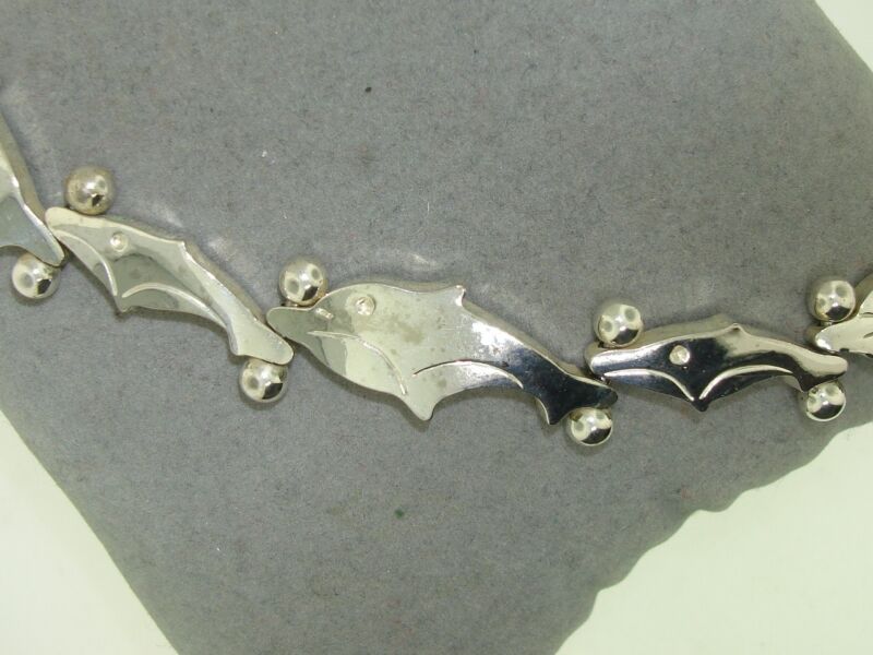Sterling silver dolphin bracelet with detailed design