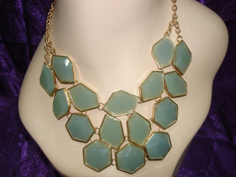 Chrysoprase bib necklace with gold-tone metal, featuring sixteen bezel-set faceted green glass stones.