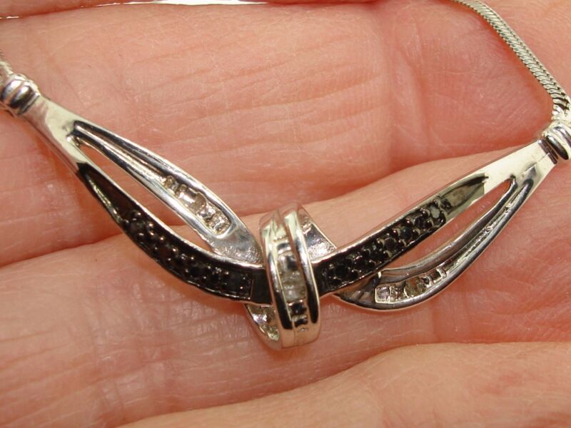 Sterling silver necklace with black and white diamonds