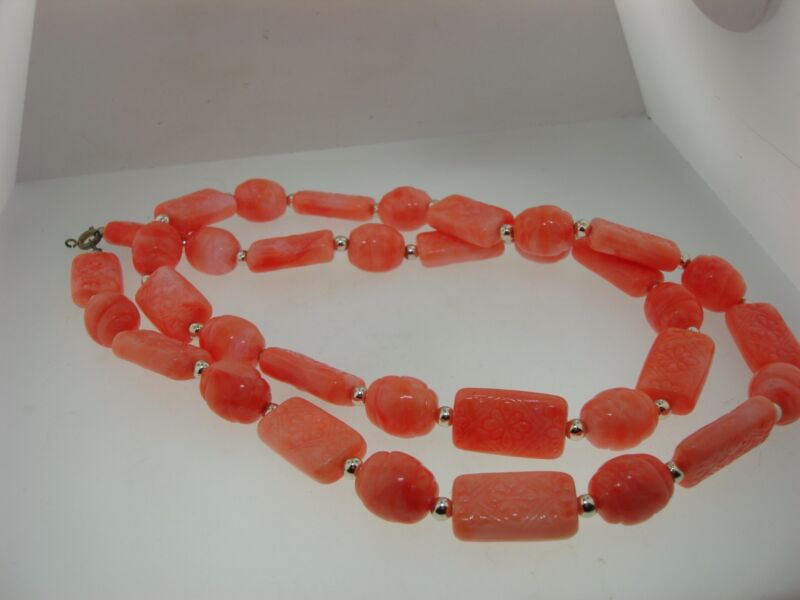 Vintage peachy-orange lucite necklace with floral and swirl beads