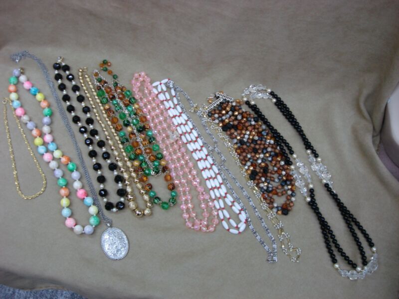 12 vintage costume necklaces in assorted styles and lengths