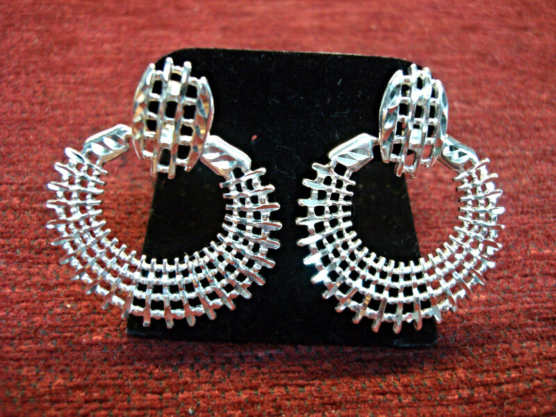 Hinged sterling silver earrings with NF hallmark