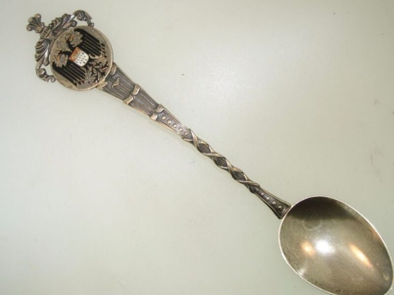 Antique German silver souvenir spoon with enamel dragon design.