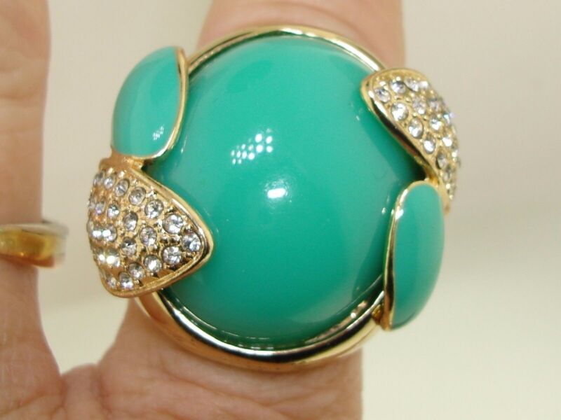 Teal blue rhinestone fashion ring, size 10, with a gold band
