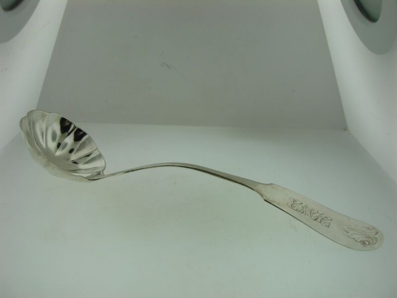 Antique coin silver cream ladle by Bunnell & Schreuder (1850s) with ruffled bowl and monogram E.M.H.