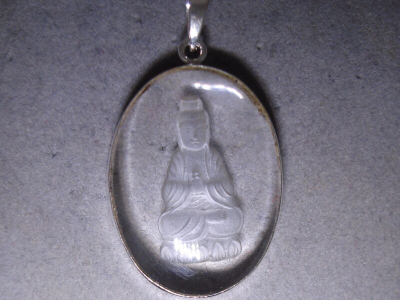 Sterling silver pendant with reverse-carved crystal Buddha