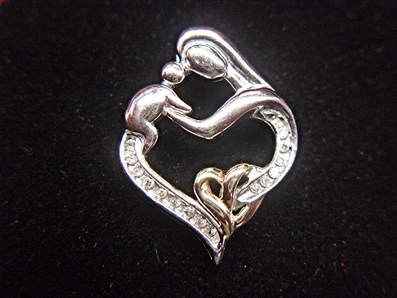 Sterling silver and 14K gold mother and child diamond pendant