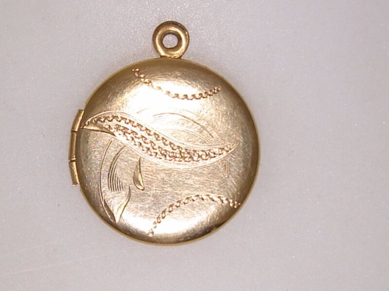 Vintage Art Deco William E. Hayward gold-filled locket with etched design and two photo compartments.
