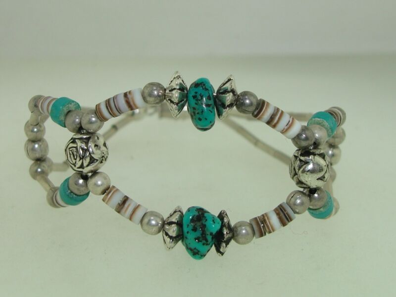 Vintage Native American style bracelet with liquid silver beads, puka shells, and turquoise nuggets