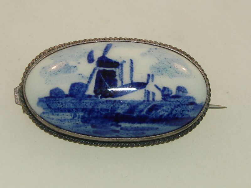 Antique artist-signed Delft porcelain pin with sterling silver bezel