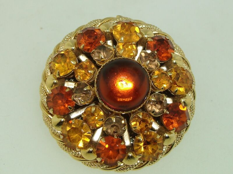 Vintage gold-tone rhinestone scarf clip with a sparkling cabochon and double clips