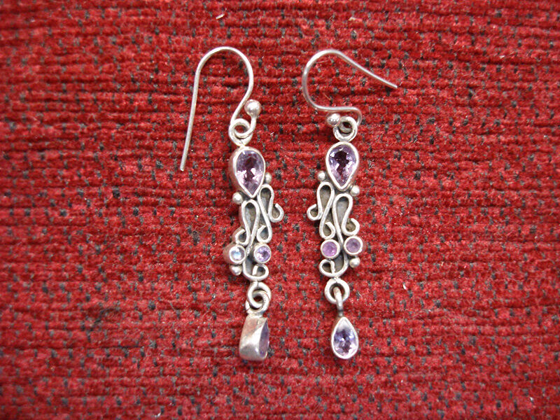 Sterling silver dangle earrings with purple gemstones