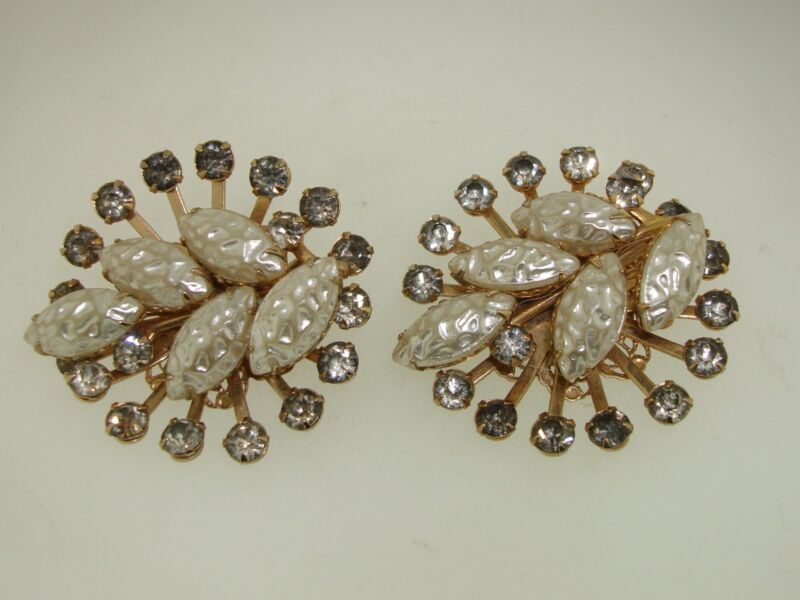 Pair of vintage 1950s gold-tone clip-on earrings with rhinestones and lucite.
