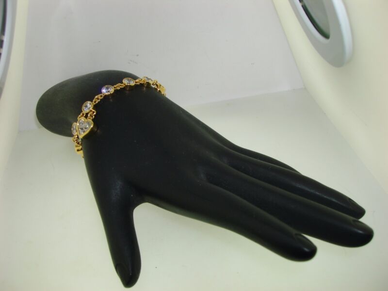 Gold-plated sterling silver toggle bracelet with open heart design and cubic zirconia stones