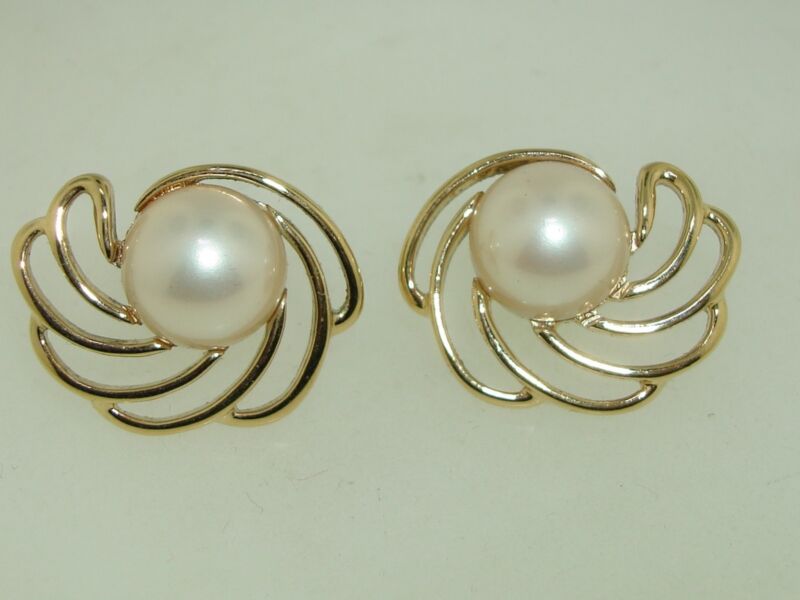 Vintage Crown Trifari clip-on earrings in gold tone with faux pearls