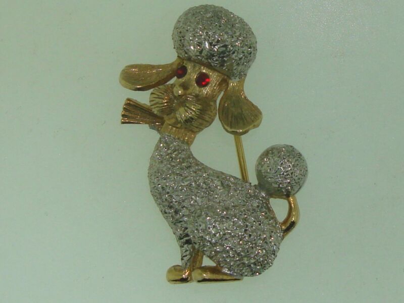Vintage gold tone poodle pin with silver stippled fur and red eyes