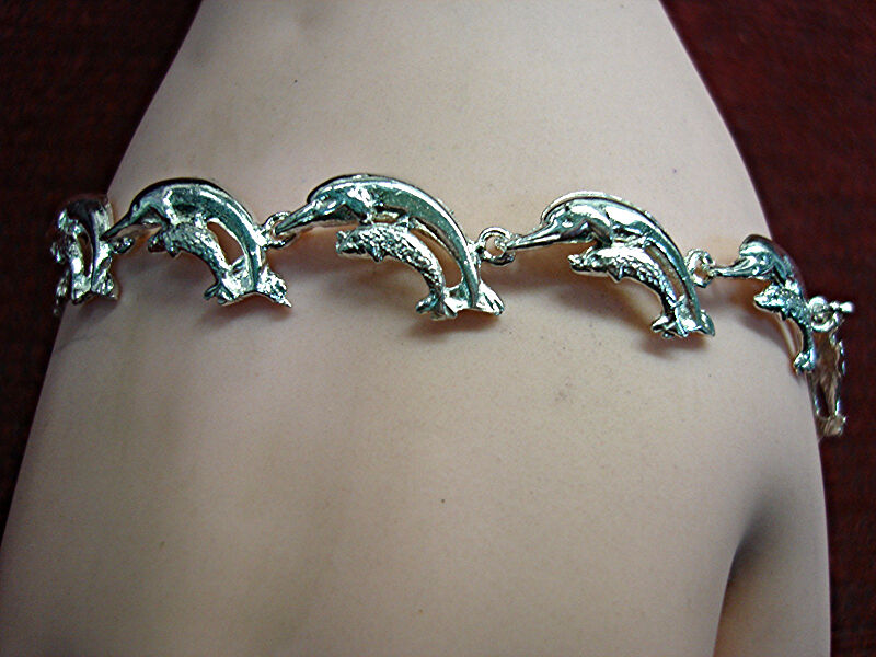 Sterling silver dolphin bracelet with eleven linked dolphins and calf detailing