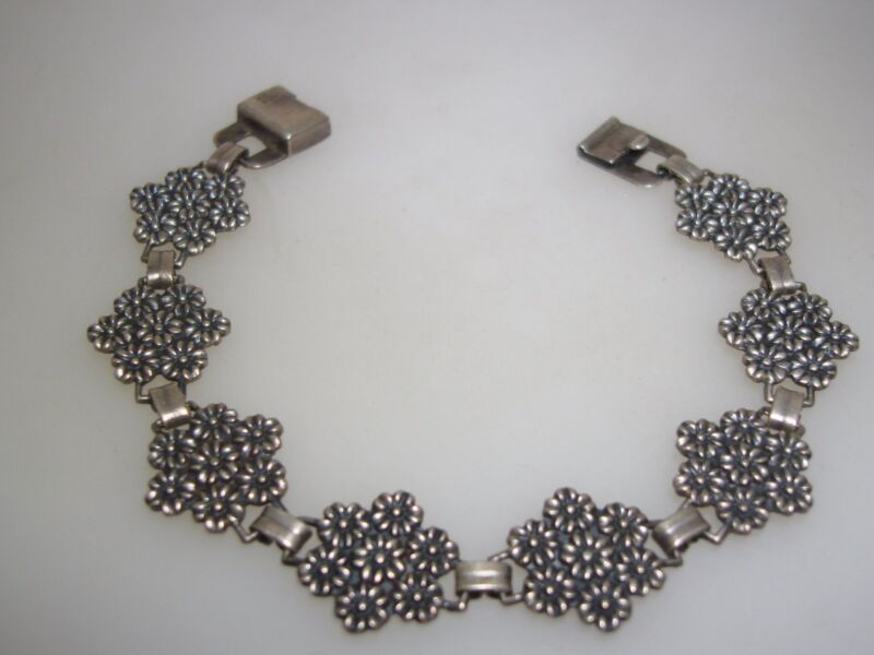 Vintage sterling silver floral bracelet with unique slide clasp, patent 1945