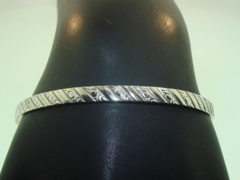 Antique Art Nouveau sterling silver bangle bracelet with swirl etched pattern