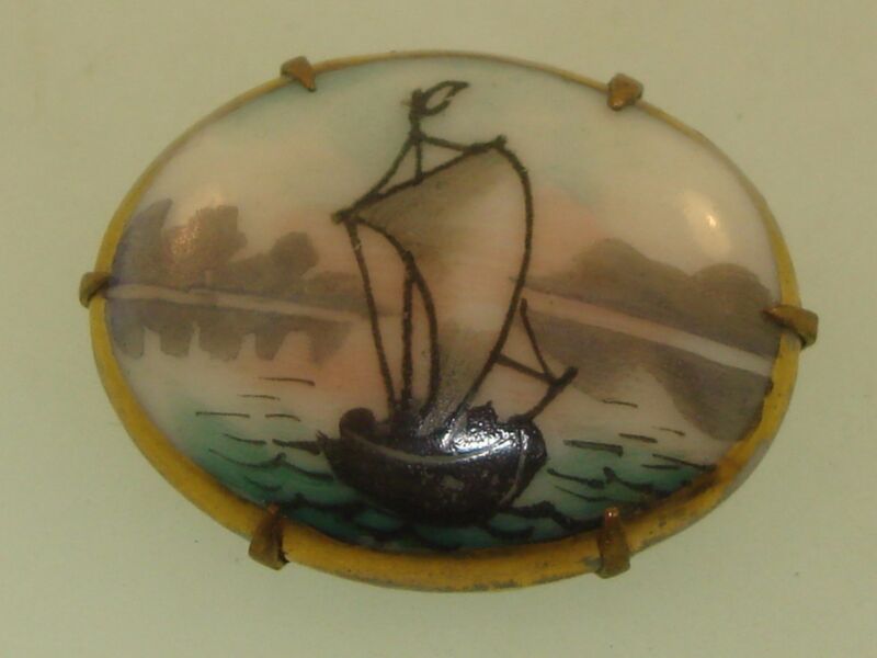 Antique Victorian porcelain sailboat pin, hand painted with gold wash