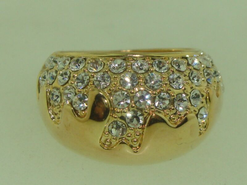 Gold-tone ring with a sparkling crystal dome design by Swarovski