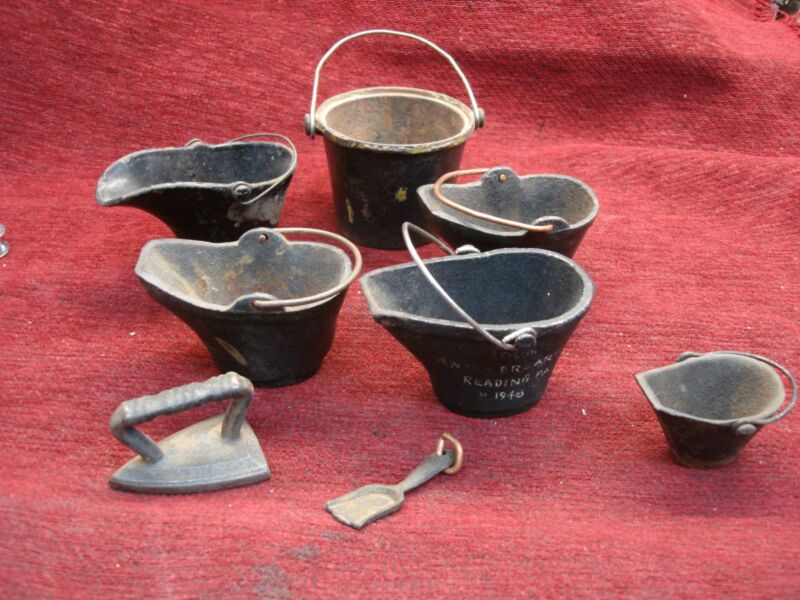 Set of six miniature vintage cast iron buckets