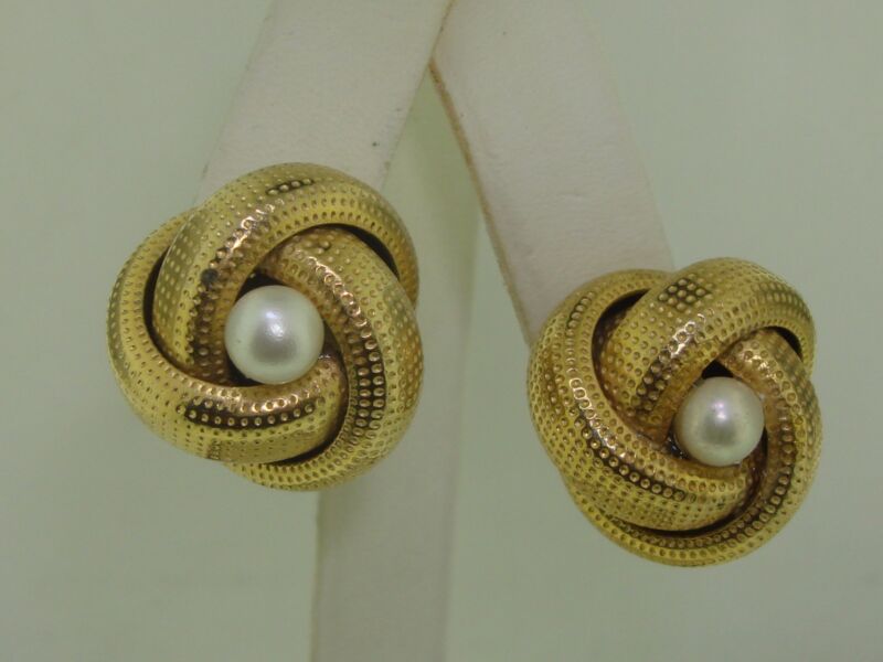 Vintage gold tone pearl earrings, 1965, with knotwork design and adjustable screw backs.