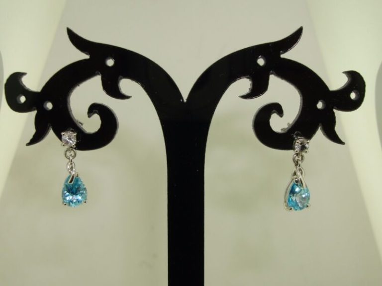 10K white gold topaz dangle earrings with blue pear-shaped topaz gemstones.