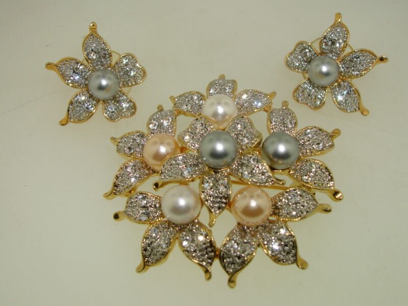 Floral pin and earring set with sparkling cubic zirconia (CZ) stones and faux pearls in pink, white, and gray hues.
