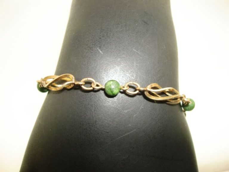 Vintage 1960s gold-filled jade bead bracelet with twisted cage design.