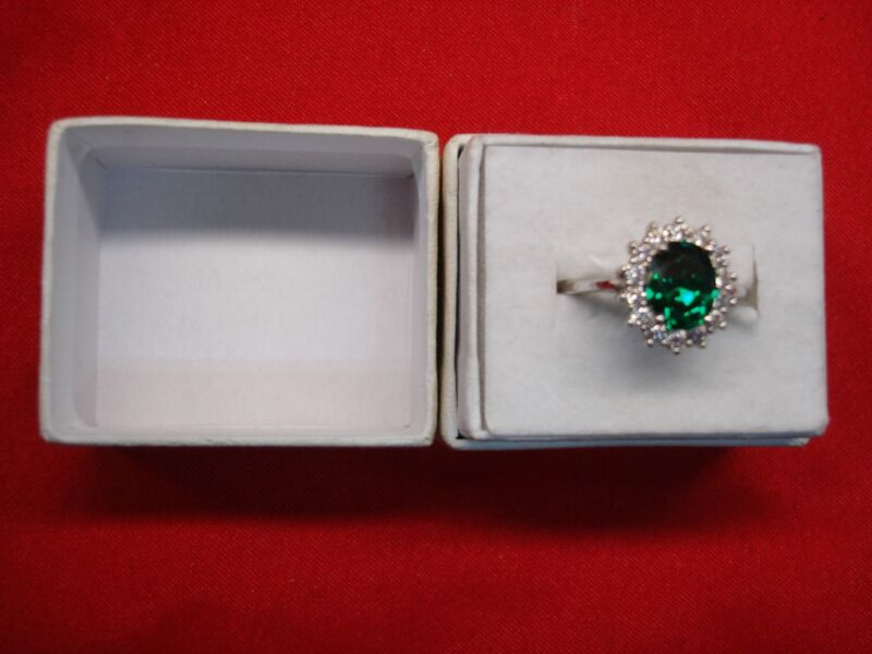 Sterling silver ring with green stone and cubic zirconia accents