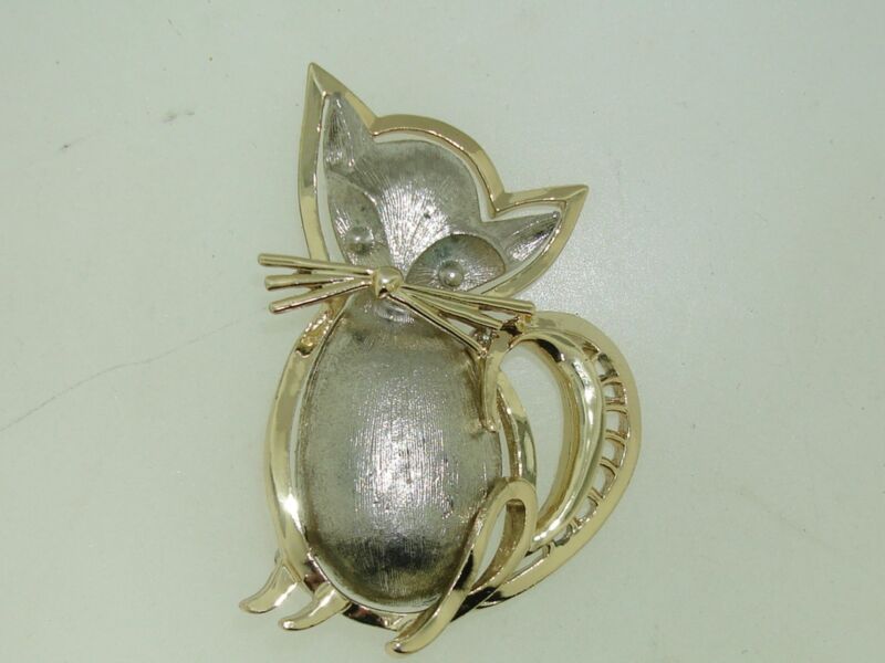 Silver and gold-tone whimsical cat pin, contemporary design