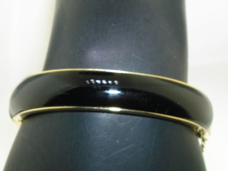 Vintage 1960s black lucite gold tone hinged bangle bracelet