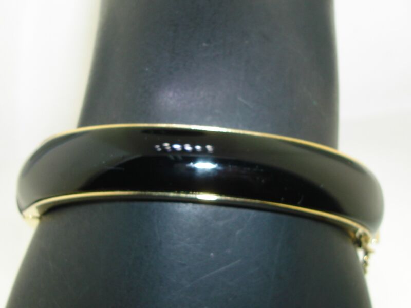Vintage 1960s black lucite gold tone hinged bangle bracelet