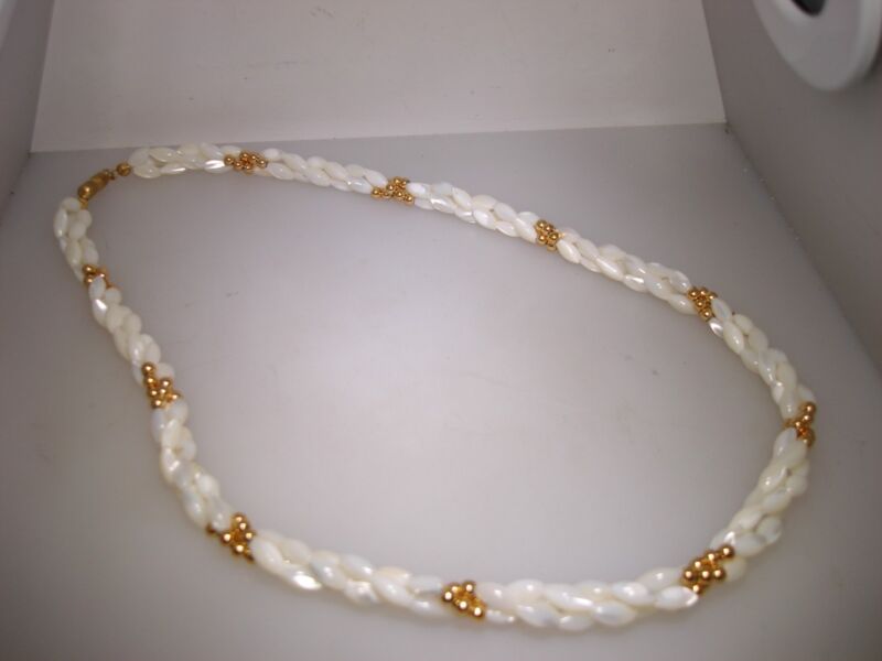 Vintage cream mother-of-pearl and gold necklace with three rows of tube beads.