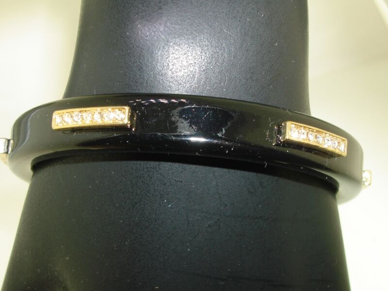 Black lacquer bangle bracelet with gold accents and rhinestones