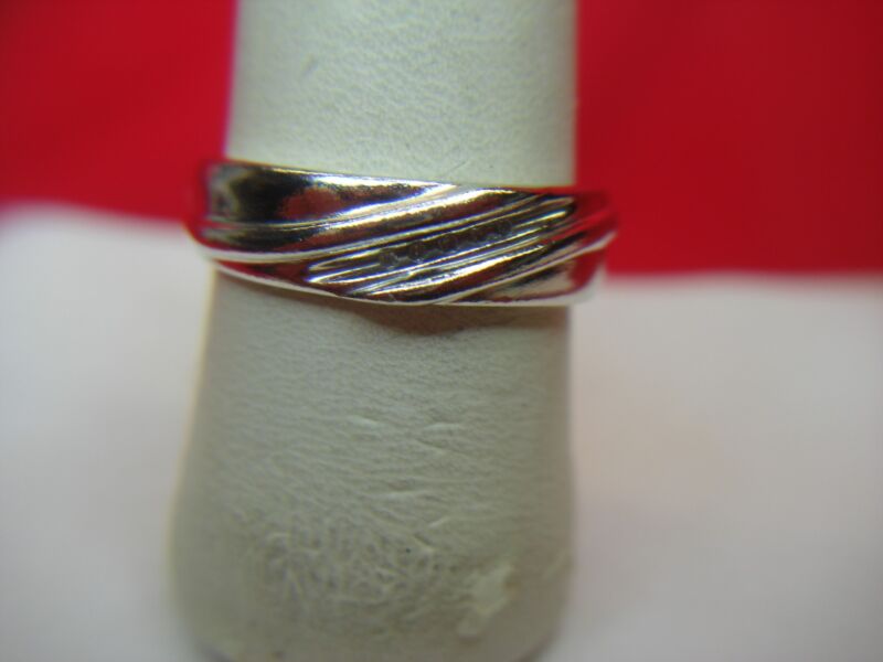Elegant sterling silver ring with five accent diamonds, size 10 1/4. Pre-owned, excellent condition.