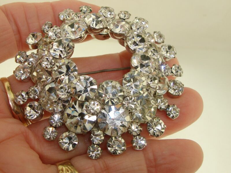 Vintage silver-tone rhinestone pin with open center design