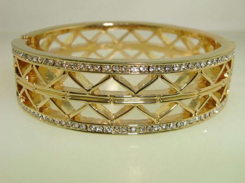 Gold tone filigree rhinestone bangle bracelet with hinged magnetic closure