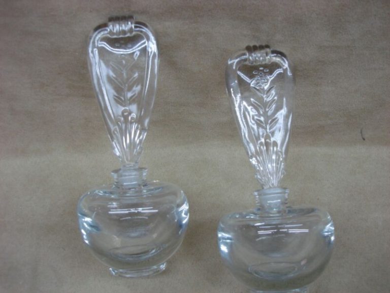 Pair of vintage lead crystal perfume bottles with ornate stoppers, excellent condition