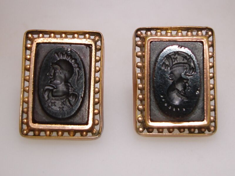 Antique Victorian swivel cufflinks in 8K rose gold with black intaglio carvings, dating back to 1880.