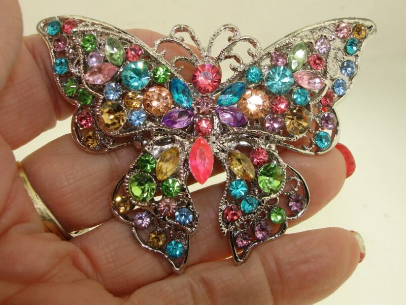 Vintage silver filigree butterfly pin with large pastel rhinestones