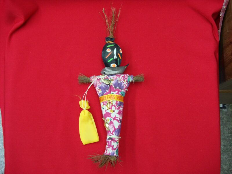 Vintage New Orleans Voodoo doll with gold charms and sash