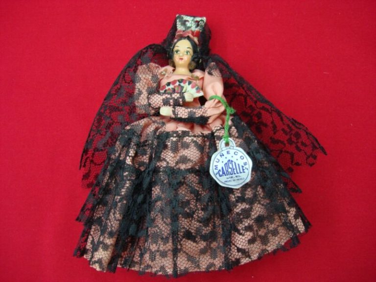 Vintage 1960s Munecos Carselle doll in a pink dress with black lace