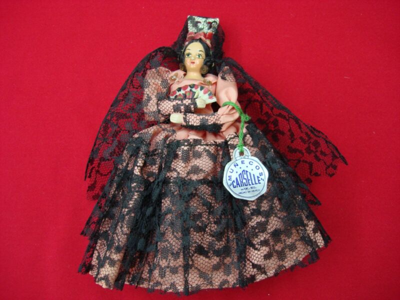 Vintage 1960s Munecos Carselle doll in a pink dress with black lace