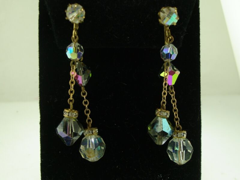 Vintage 1970s gold tone rhinestone dangle earrings with champagne aurora borealis bicone and channel-set crystals