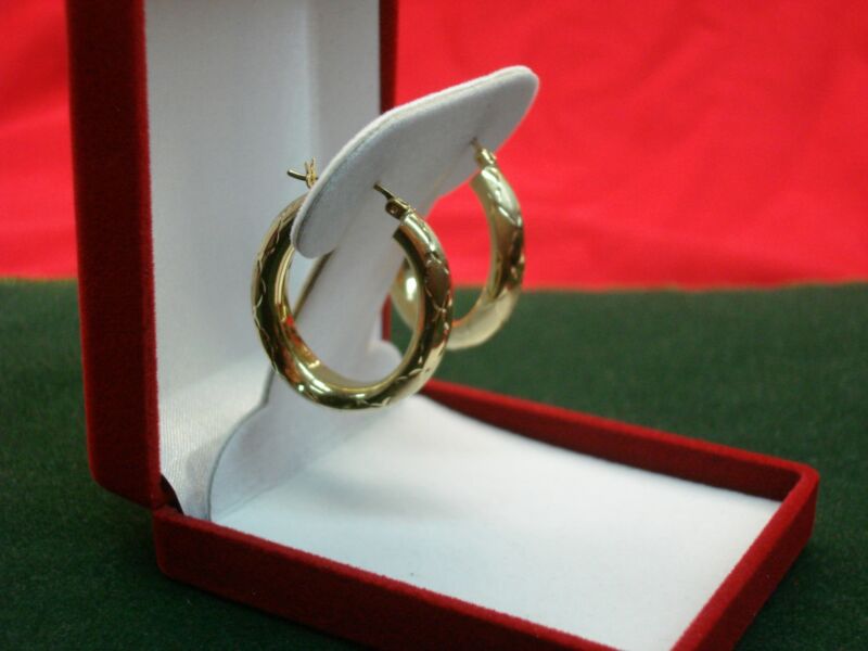 14K yellow gold puffy hoop earrings with diamond cut accents