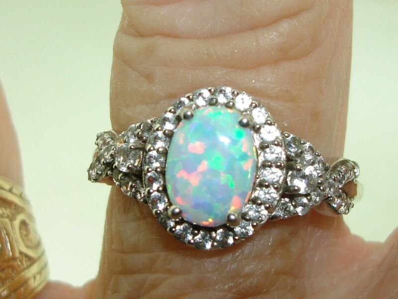 Sterling silver ring with cubic zirconia and faux opal accents