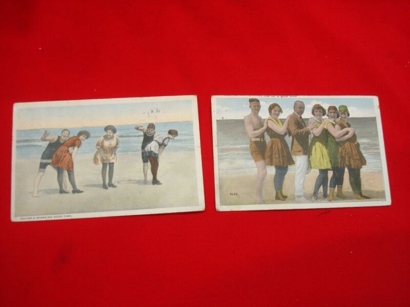 Pair of vintage bawdy postcards from the 1920s with playful messages, "HAVING A SPANKING GOOD TIME" and "IN LINE FOR A GOOD TIME"
